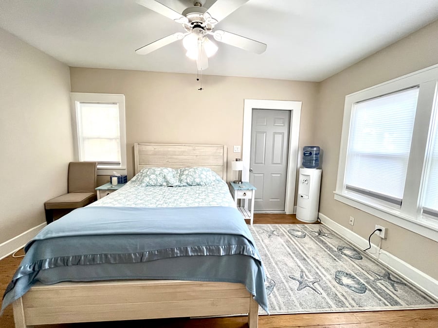 Queen bed includes sheets, pillows, quilt.
