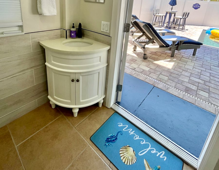 Bathroom 2 - sink and proximity to patio & pool.