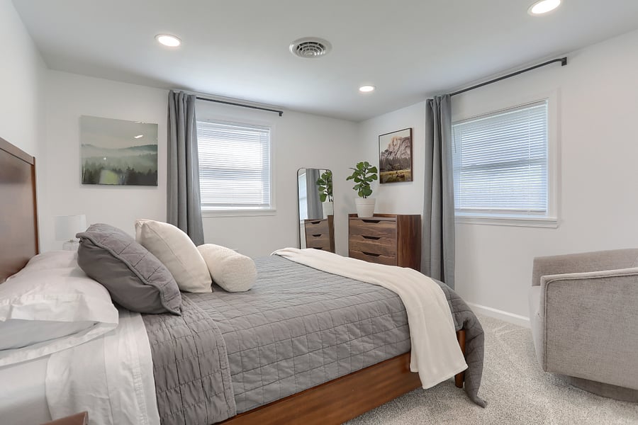 #1 bedroom with queen bed & sitting chair