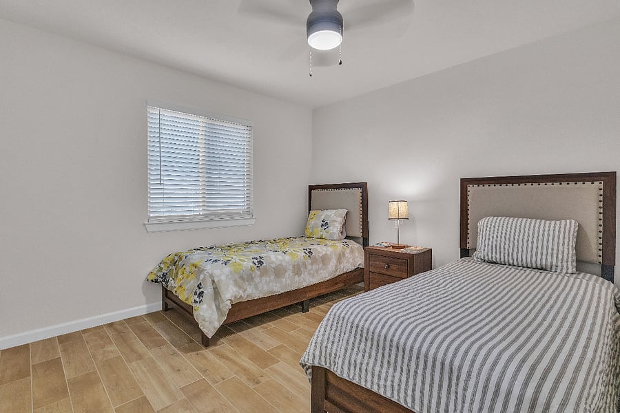 Two twin beds in second bedroom.