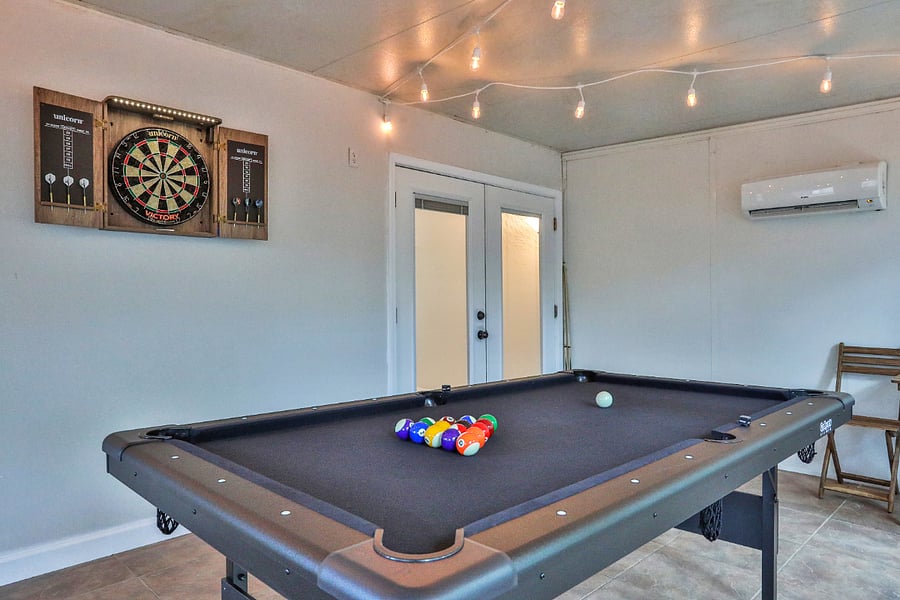 Sunroom with Pool Table, Dart Board and A/C unit.