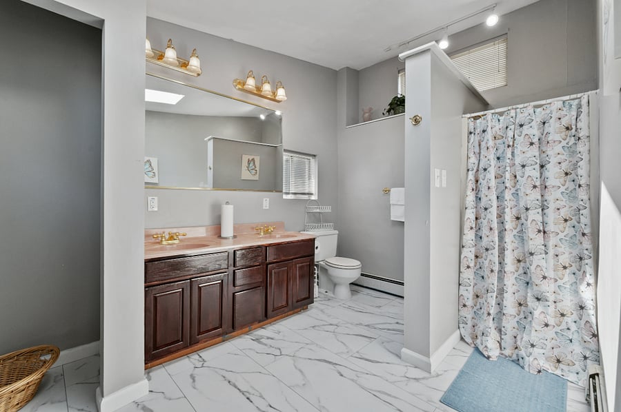 Second floor master bathroom with Jack and Jill sinks, shower and high quality towels