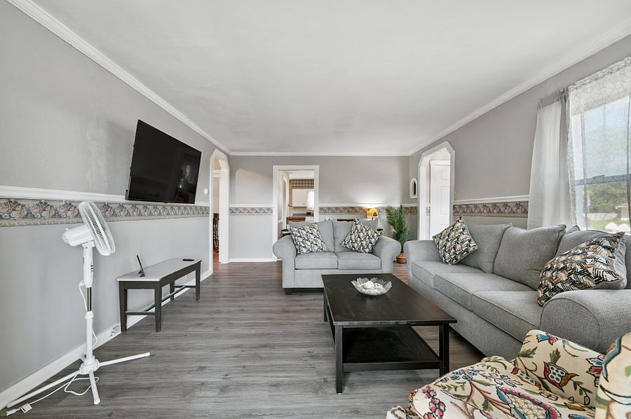 Beautiful living room with modern furniture and 50" Smart TV with streaming