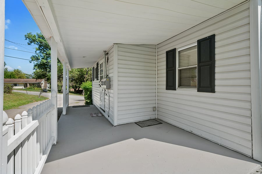 Side porch self-check in entrance to home