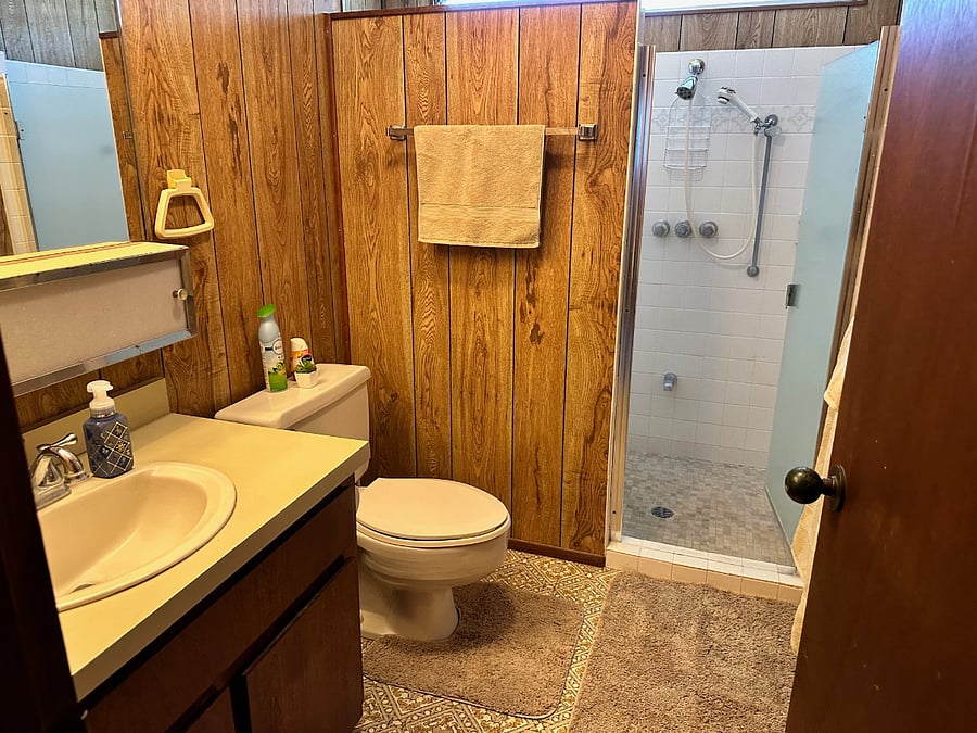 Full bathroom with walk-in shower and a clean, functional design.