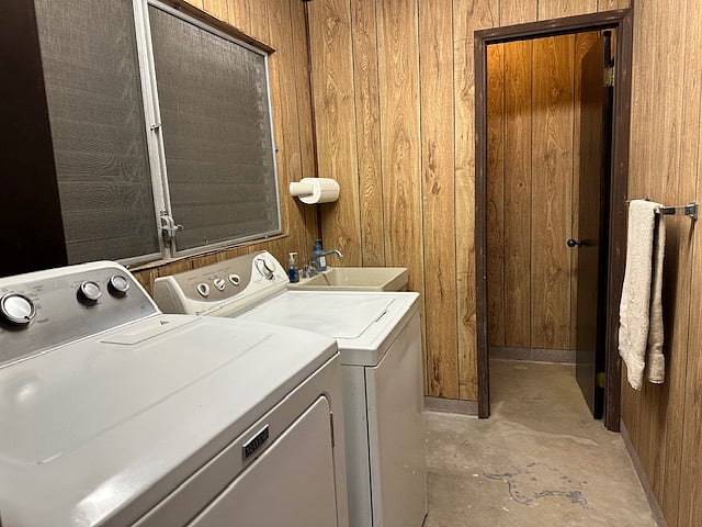 Laundry area with washer/dryer and an additional half bath for everyday convenience.