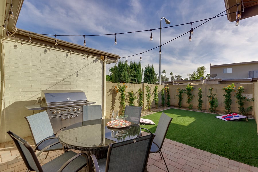 Private backyard with artificial turf. *Note: the hedge is now fully grown for ultimate privacy!
