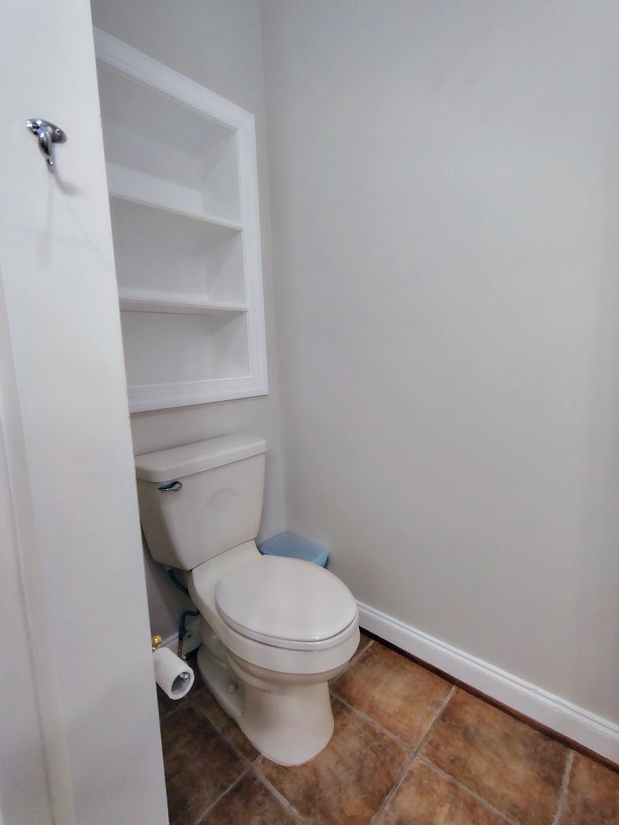 PARKVIEW-toilet area has charming built-in feature for extra storage or display