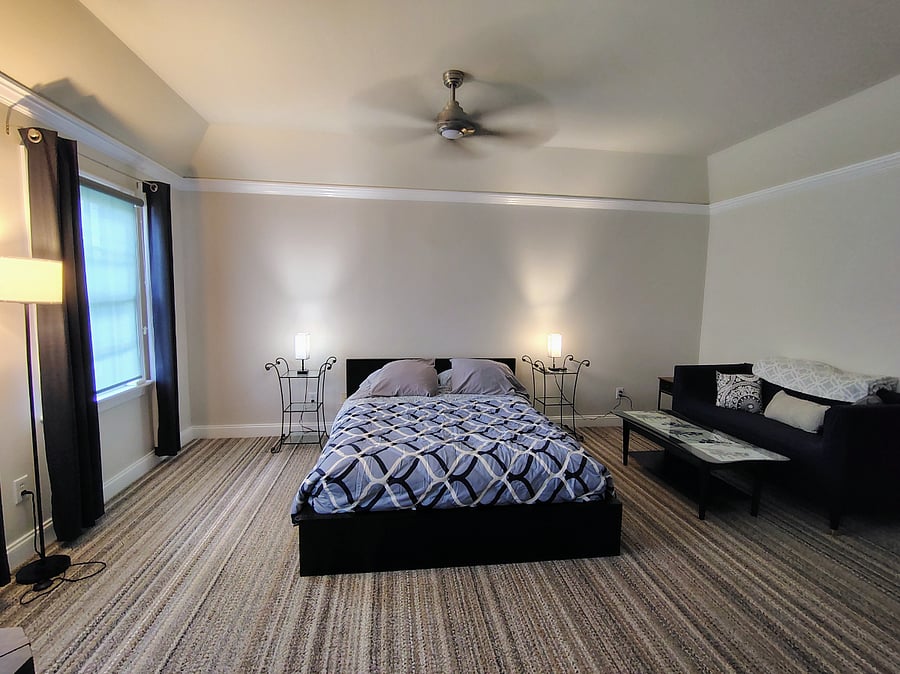 PIEDMONT--Overview of room includes the bed and couch area