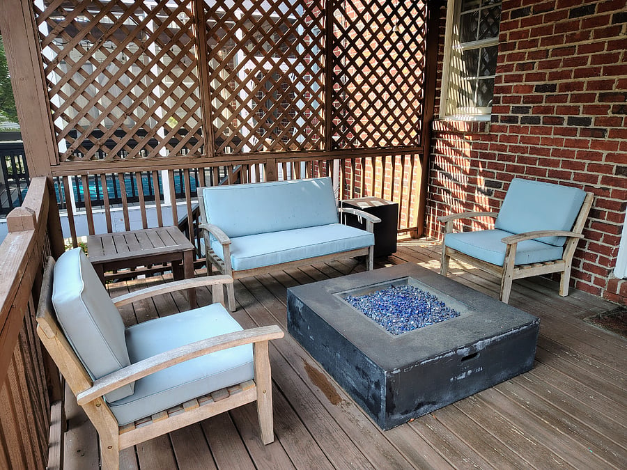 Private deck with outdoor furniture and gas fire pit