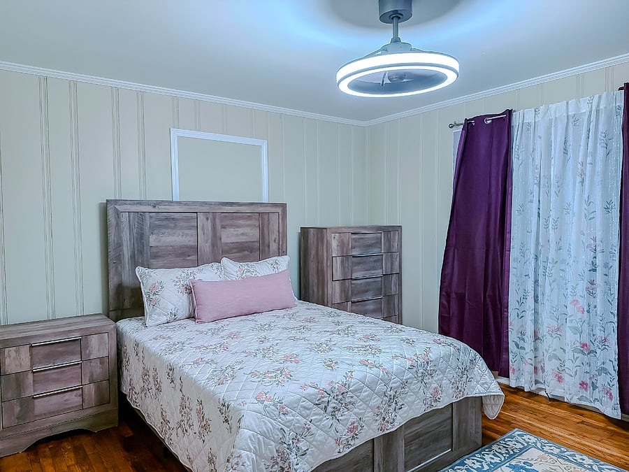 Bedroom 1: Queen bed with dresser, mirror, and night stand