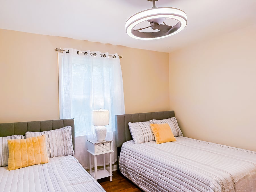 Bedroom 2: two full beds and lamp