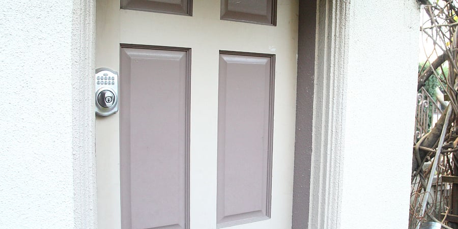 Deadbolt lock to apartment opened by numeric keypad (same code as garden gate door)