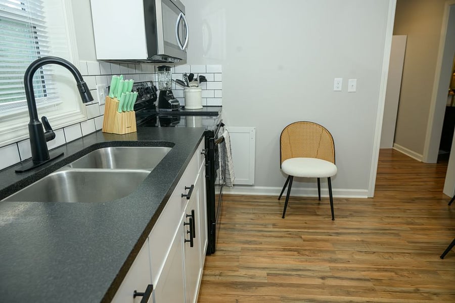 A cooks kitchen: garbage disposal and full size appliances.