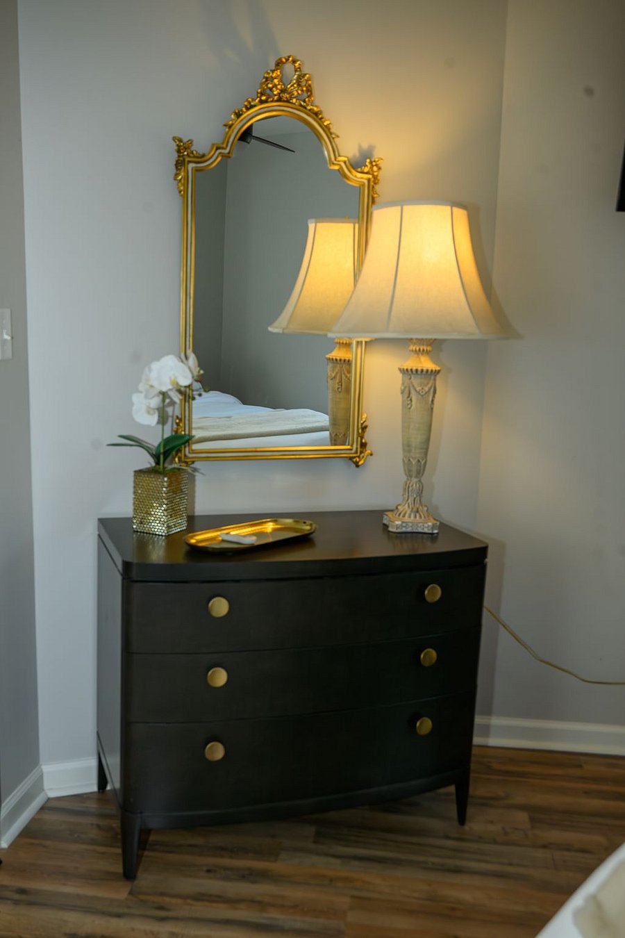Storage and large mirror in main bedroom.