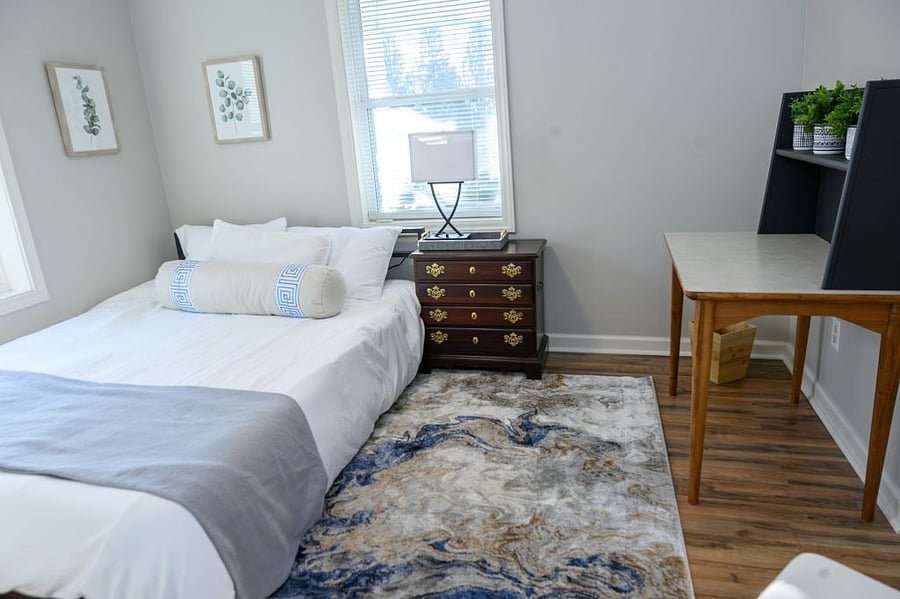 Bedroom number two also has a queen bed with a fluffy comfortor.