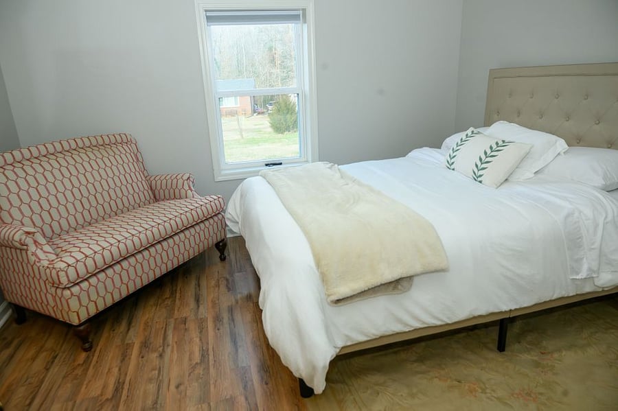 Relax on this custom sofa in the main bedroom