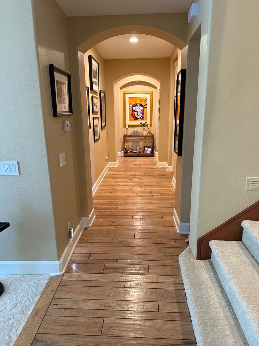 Hallway from front entry to Kitchen, Family Room, Powder Room, and Living Room.
Stairs to the 2nd floor.