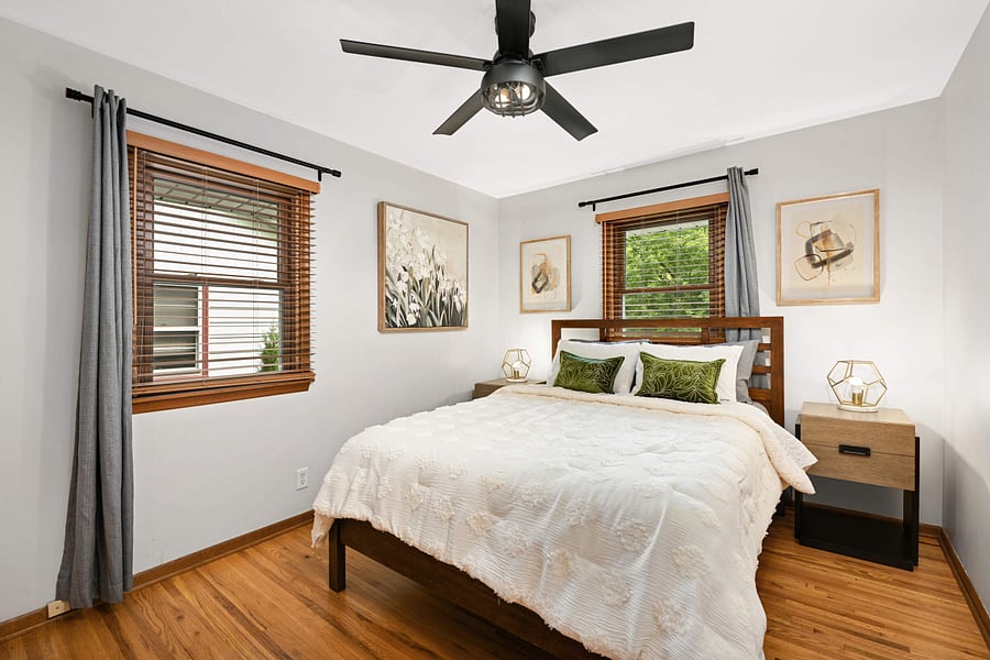 Main floor bedroom with Queen bed and wall mounted Smart TV