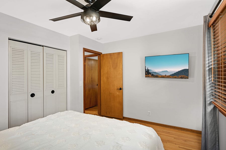 Main floor bedroom with Queen bed and wall mounted Smart TV