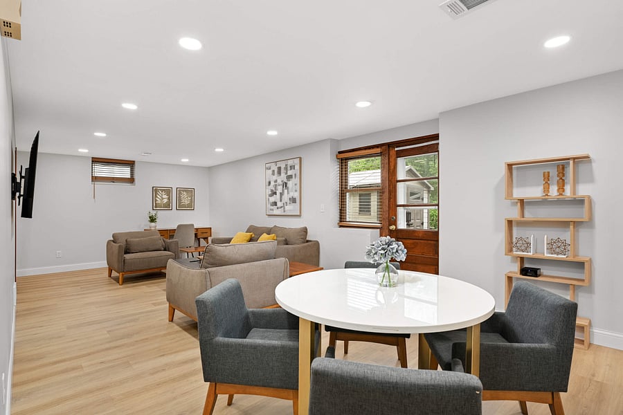 Lower Level family room with wall mounted smart TV and dedicated work-from-home area