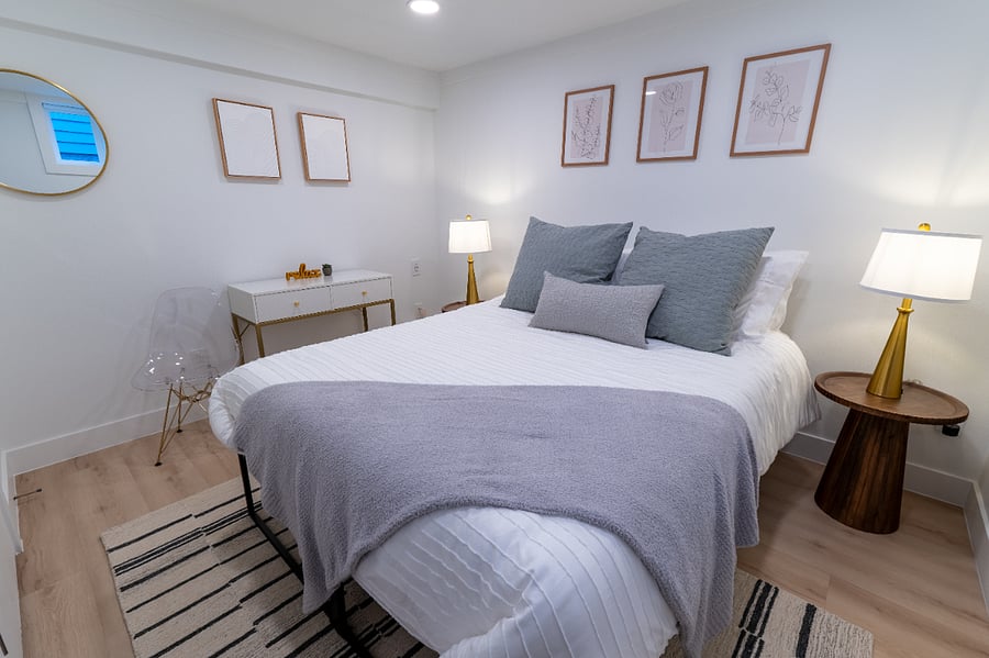 Cozy bedroom featuring a restful bed and a work desk for working or planning your day.