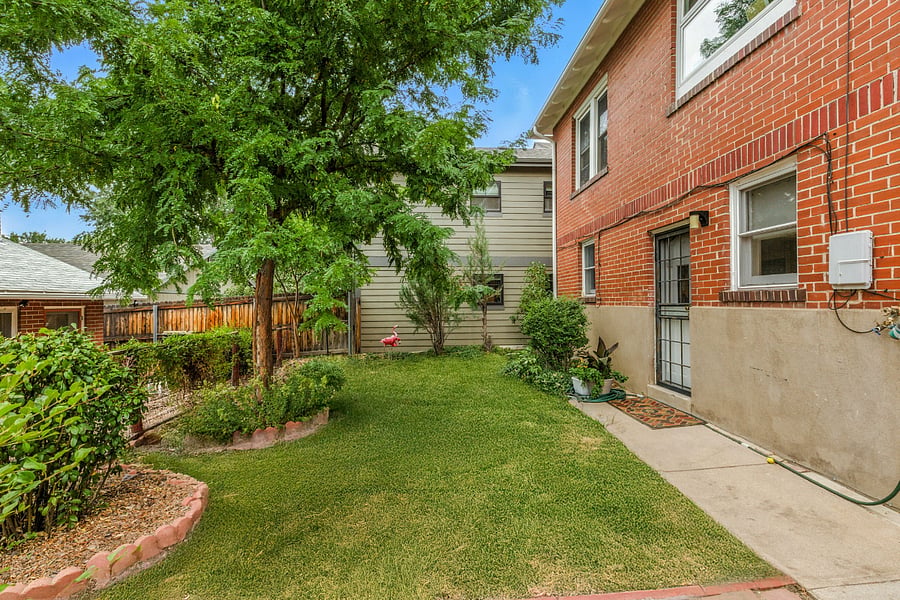 Shared back lawn behind apartment toward the north