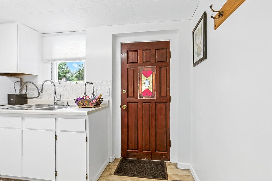 Kitchen2 with wood and leaded glass door closed into back yard