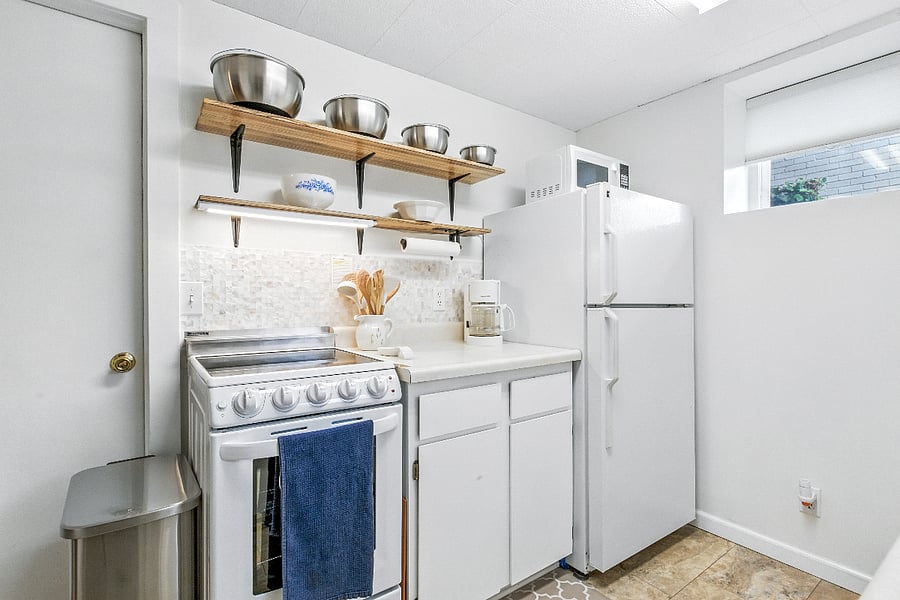 View of kitchen toward NE; utility room on other side