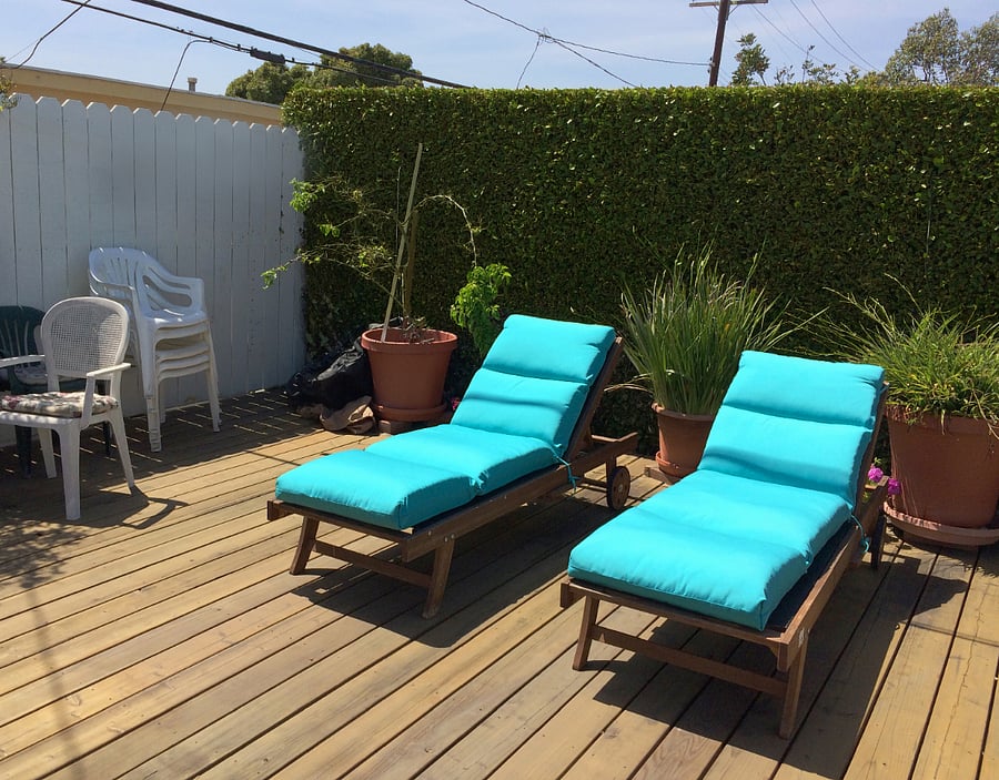 Deck north - 2 chaise lounges, w/ canvas covers. Umbrella also on deck.