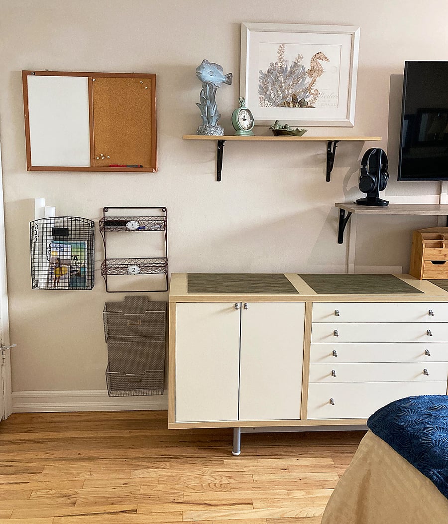 Wire wall baskets, cork/dry erase board, horiz. dresser & wall shelves w/ TV wifi headphones.