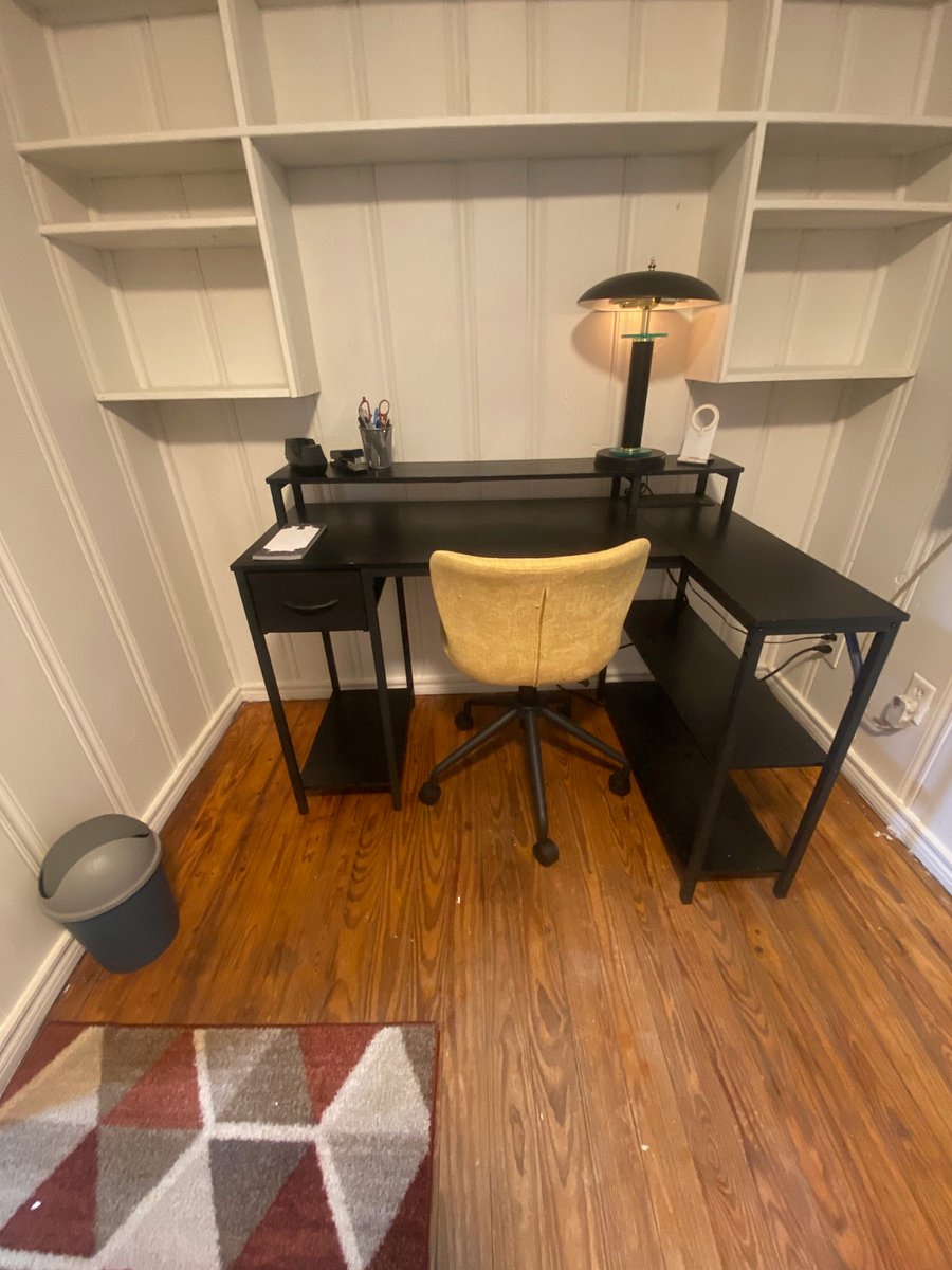 Workspace desk set with rolling chair is on opposite side of kitchen away from other noises of the house. TApe, stapler, pens and pad provided to get you started.
