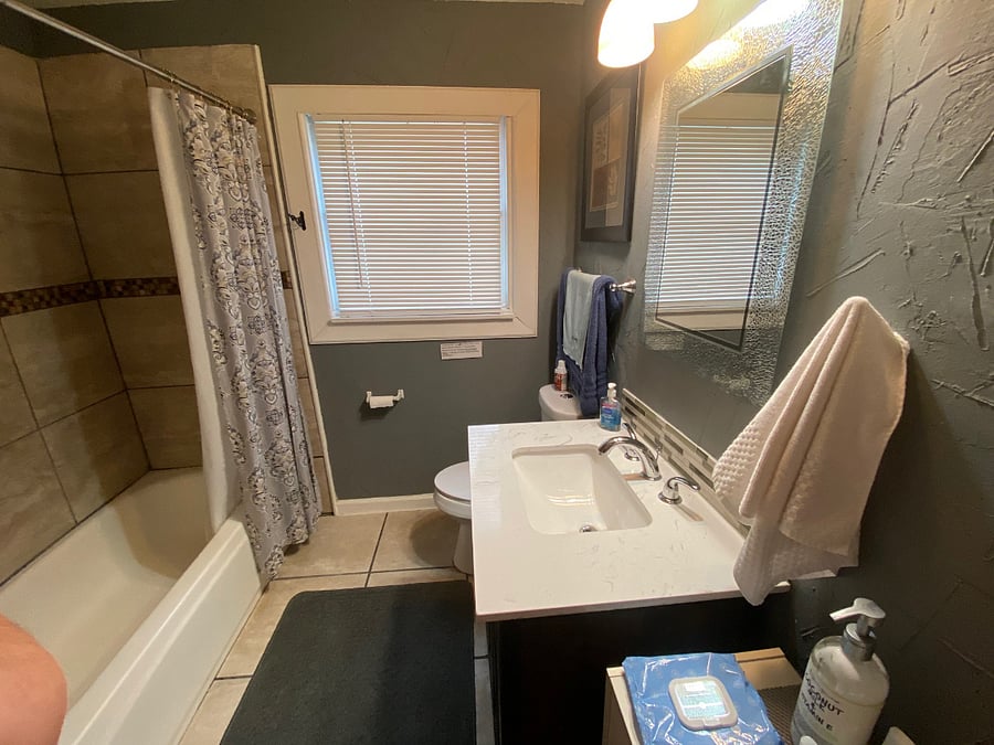 Full bathroom with ceramic tile, full tub/shower with amenities...shampoo, creme rinse, shower gel, cotton balls, Q-tips,lotion, makeup rem pads. 