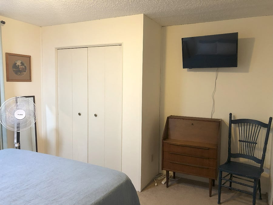 Closet, secretary desk, TV, floor fan & chair