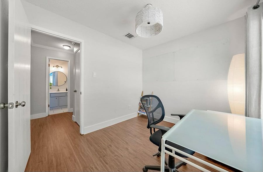 Office with acrylic dry eraser board. Hard to see but its there on the back wall.