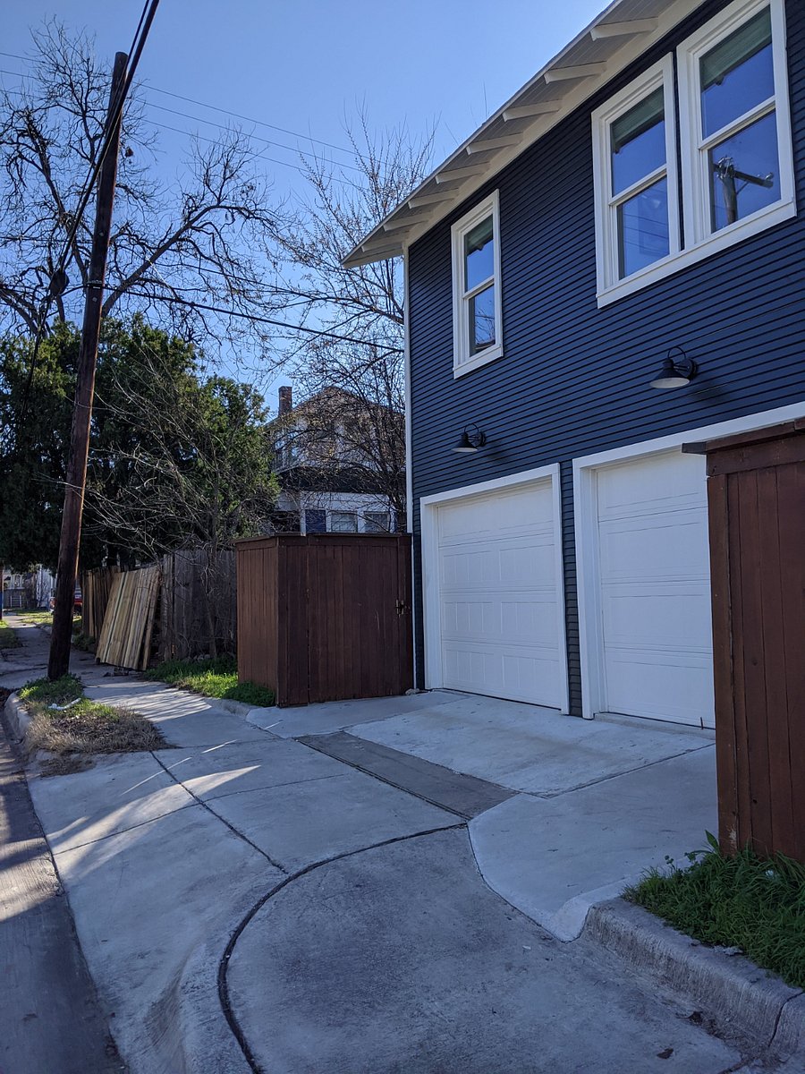 Private gate to access stairwell to apartment. Backs up to shared alleyway. Gate has a top latch, and there is a security light triggered by movement, for added security and peace of mind.