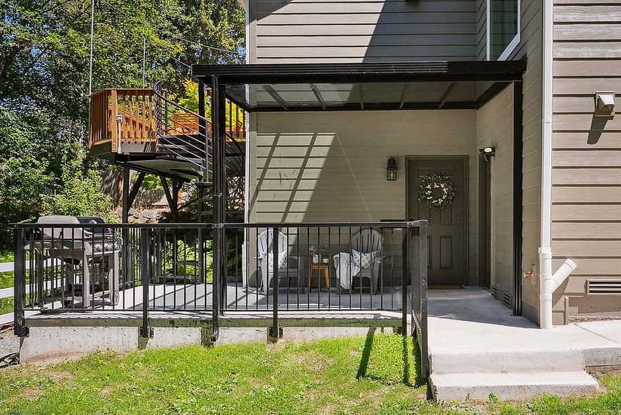 Front door to apartment located under cover