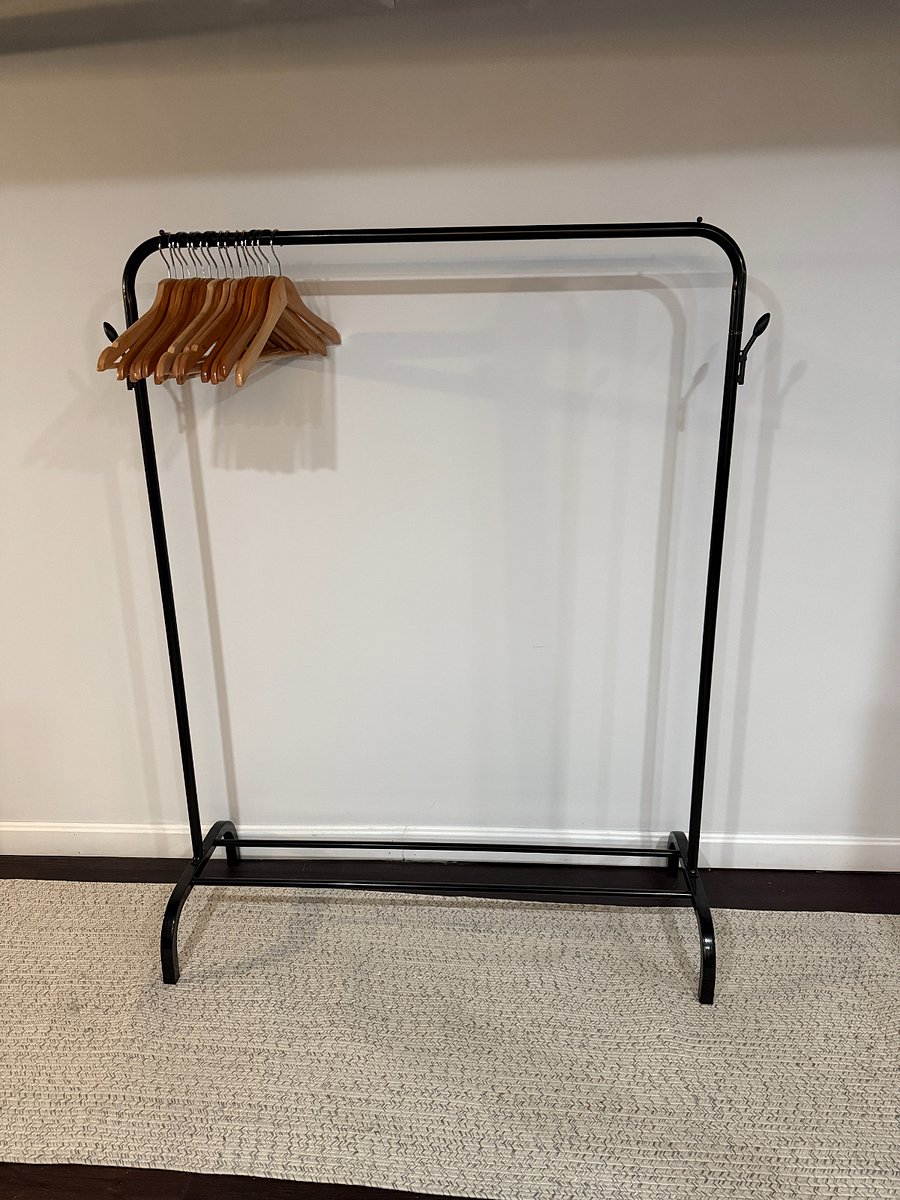 Free standing clothing rack for hanging clothes