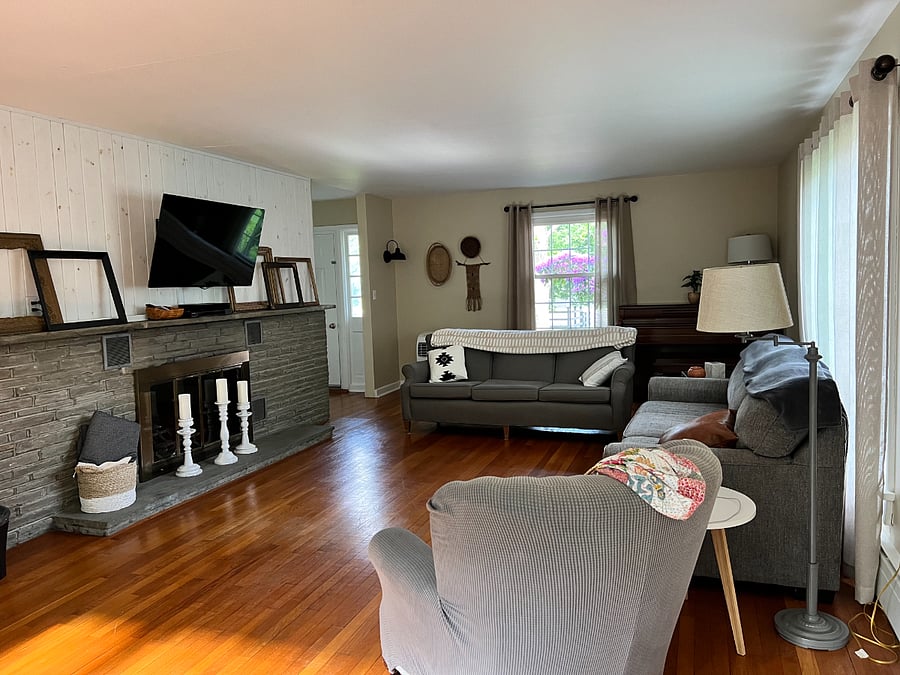 Main living area with TV, fire place and seating for 10