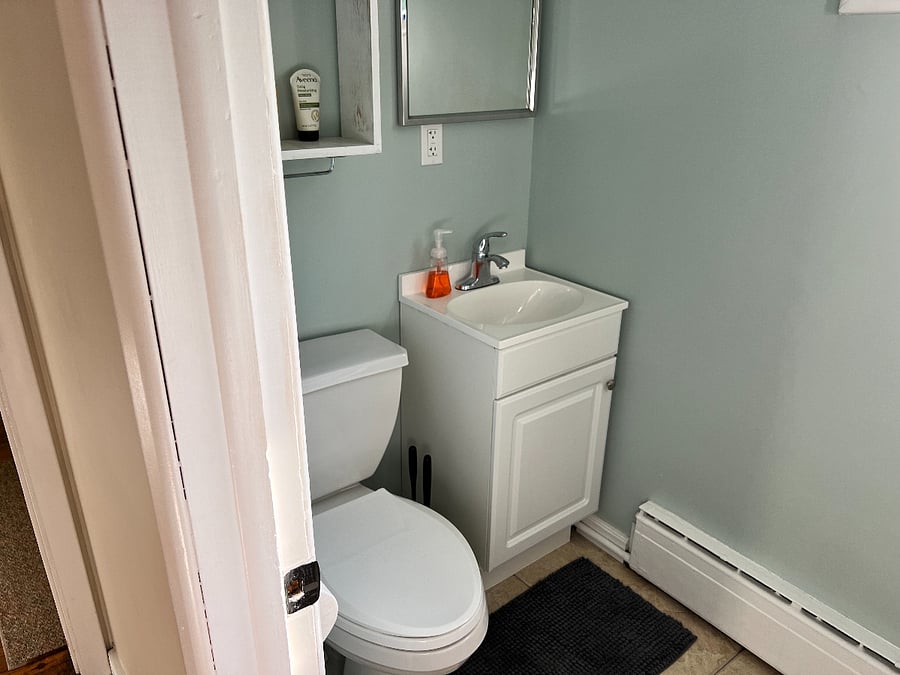 Bathroom 2: Full bath with toilet, sink and shower stall