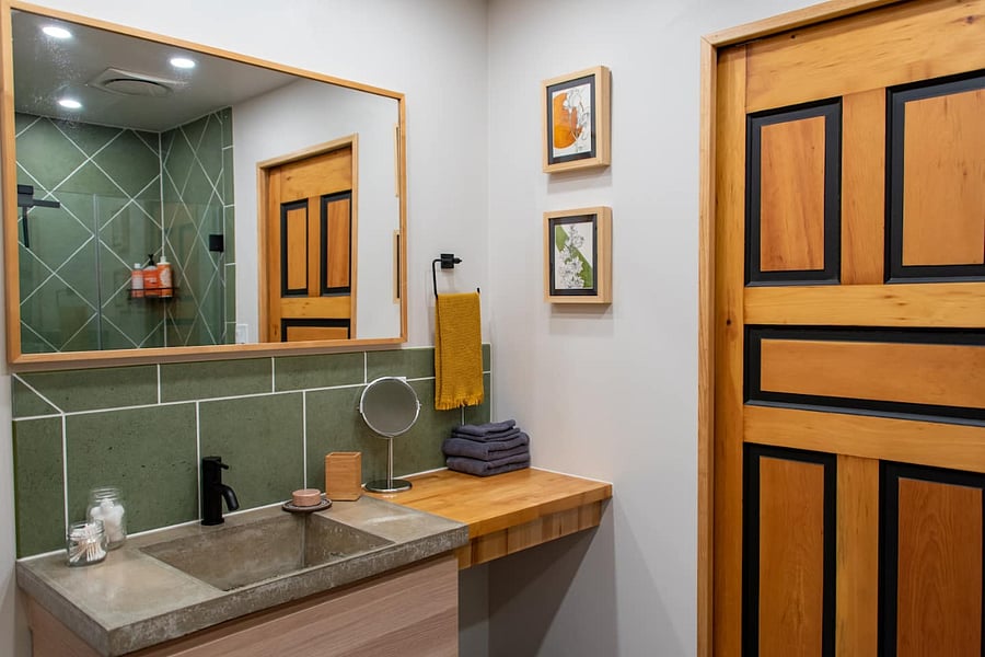 Bathroom with toilet cubbie, laundry, and a great shower