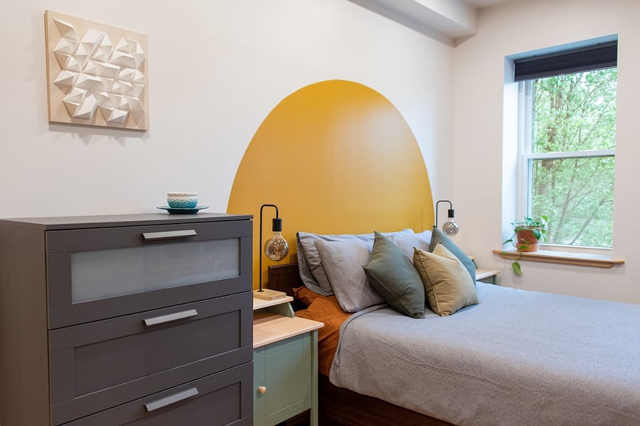 Bedroom with dresser and closet for storage during your stay