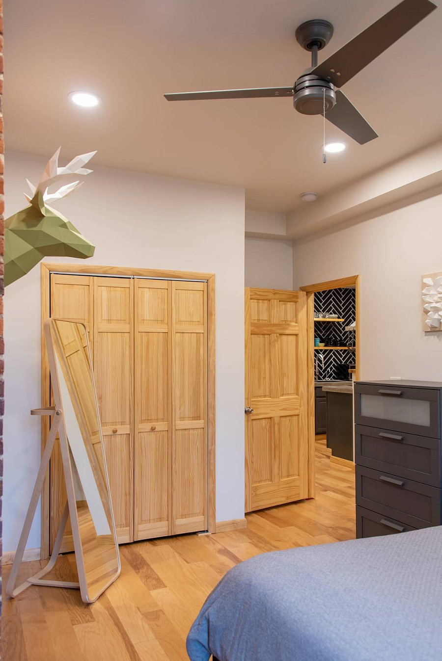 Bedroom closet and view into the main living room and kitchen area