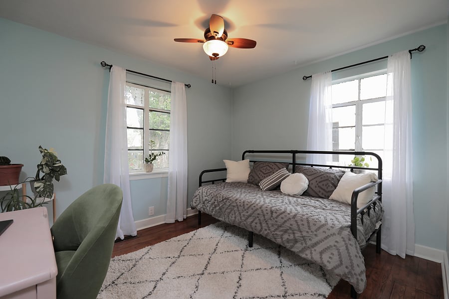 2nd bedroom/office with desk and rolling chair
