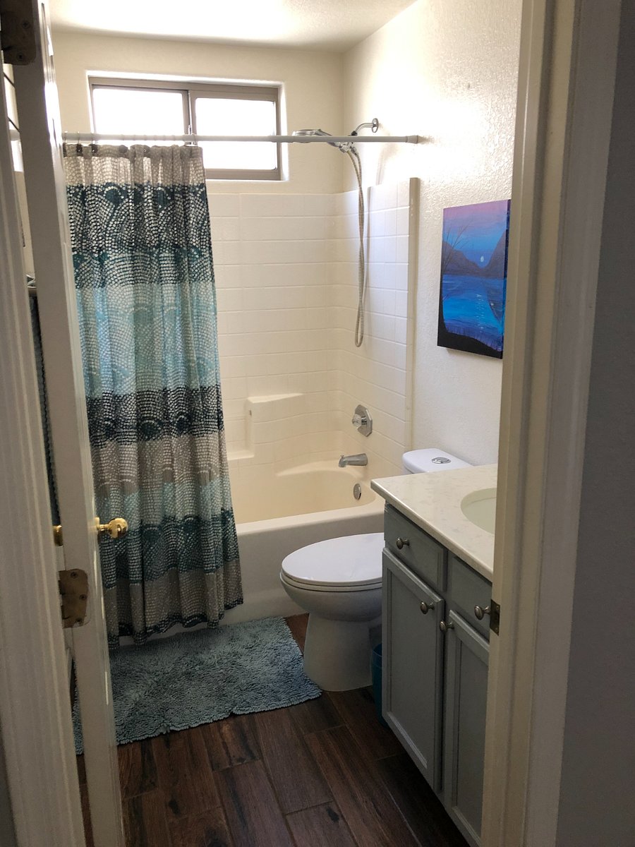Shared bathroom with shower Fin hallway. Bathroom can be shared by guests staying in guest bedroom #1 and guest bedroom #2