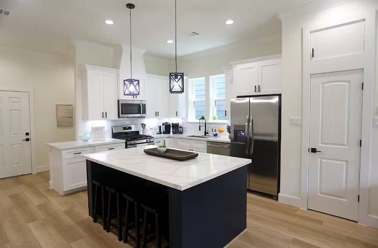 Clean, bright, chef's kitchen complete with dishwasher, gas stove, ice maker, and garbage disposal. Coffee bar includes a Keurig, French press with electric kettle, and a programmable coffee maker! Plenty of other appliances including a crockpot. 