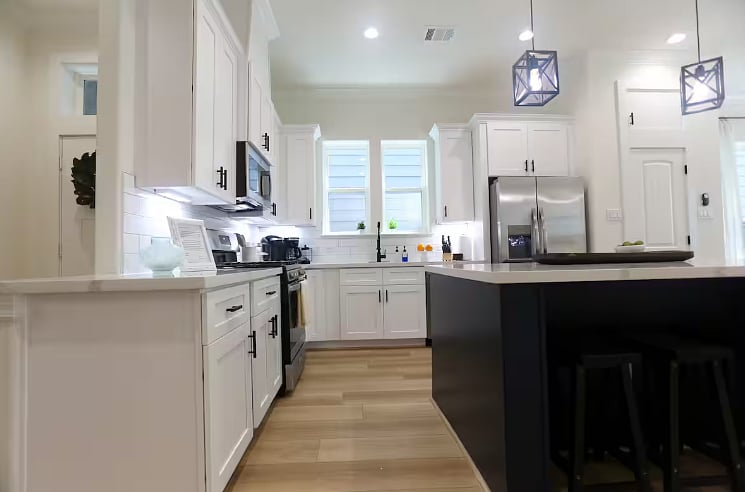 Clean, bright, chef's kitchen complete with dishwasher, gas stove, ice maker, and garbage disposal. Coffee bar includes a Keurig, French press with electric kettle, and a programmable coffee maker! Plenty of other appliances including a crockpot. 