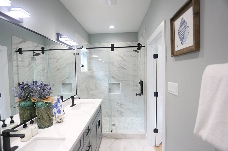 Spacious & modern en suite bathroom for Bedroom One. Includes walk-in shower & beautiful double vanity with plenty of counter space. Each bathroom contains a hair dryer, shampoo, conditioner, body wash, and hand soap.