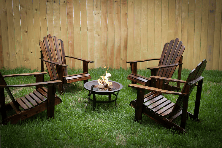 Cozy firepit with four adirondack chairs for cozying up with friends & family on chilly evenings! Pet-friendly with a backyard and privacy fencing! 