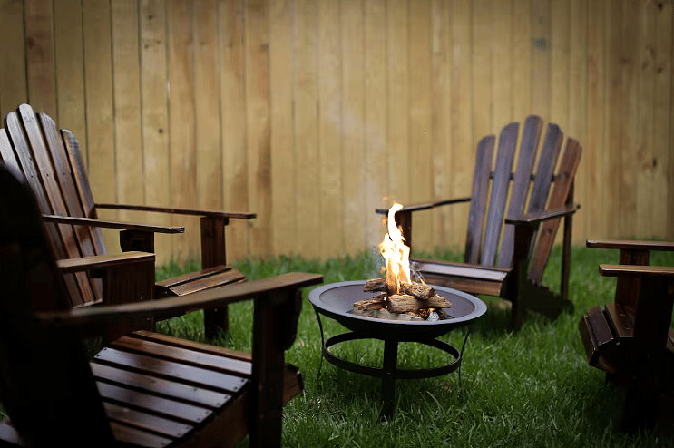 Cozy firepit with four adirondack chairs for cozying up with friends & family on chilly evenings! Pet-friendly with a backyard and privacy fencing! 